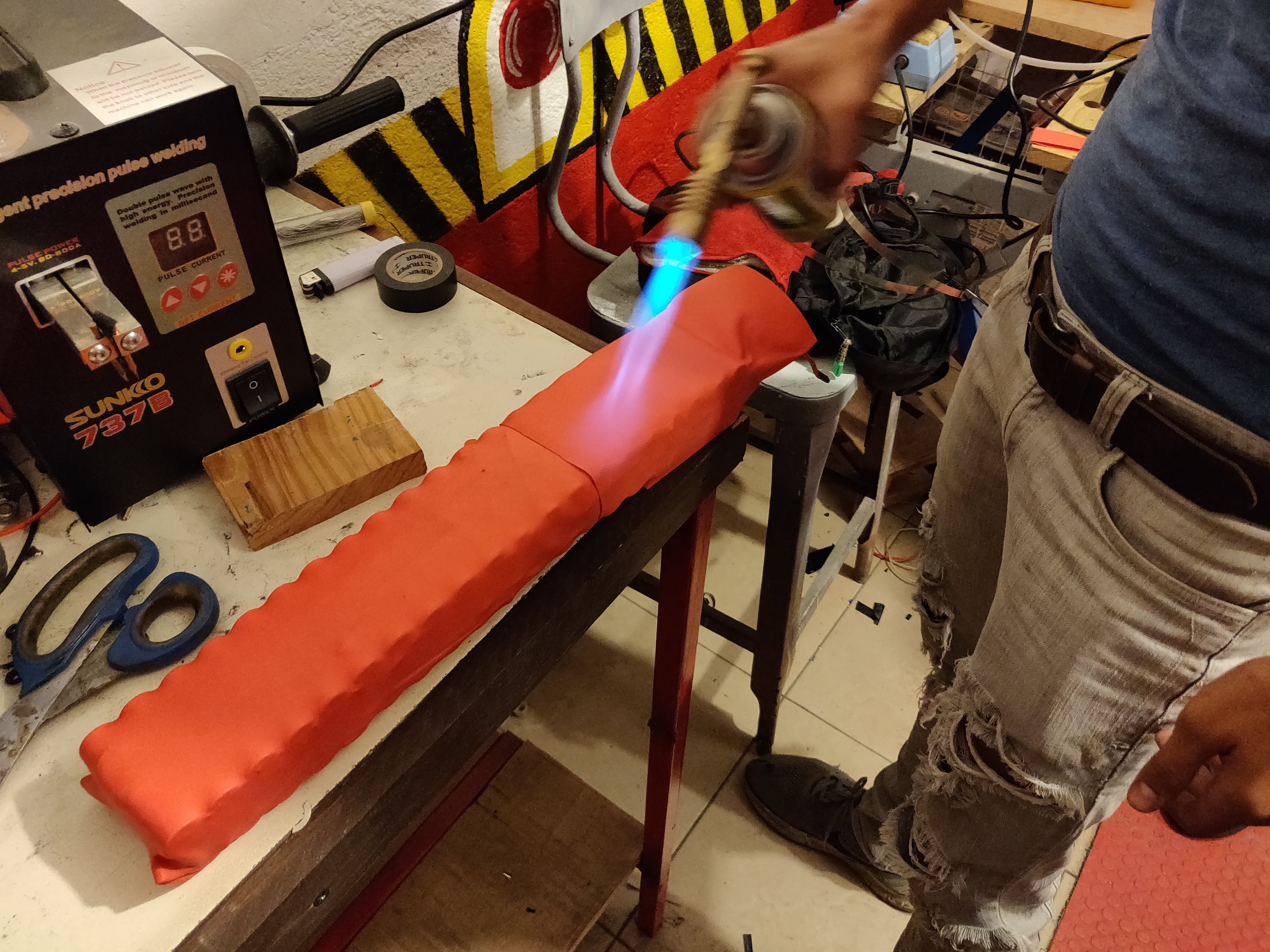 Heatshrink being applied to the battery pack